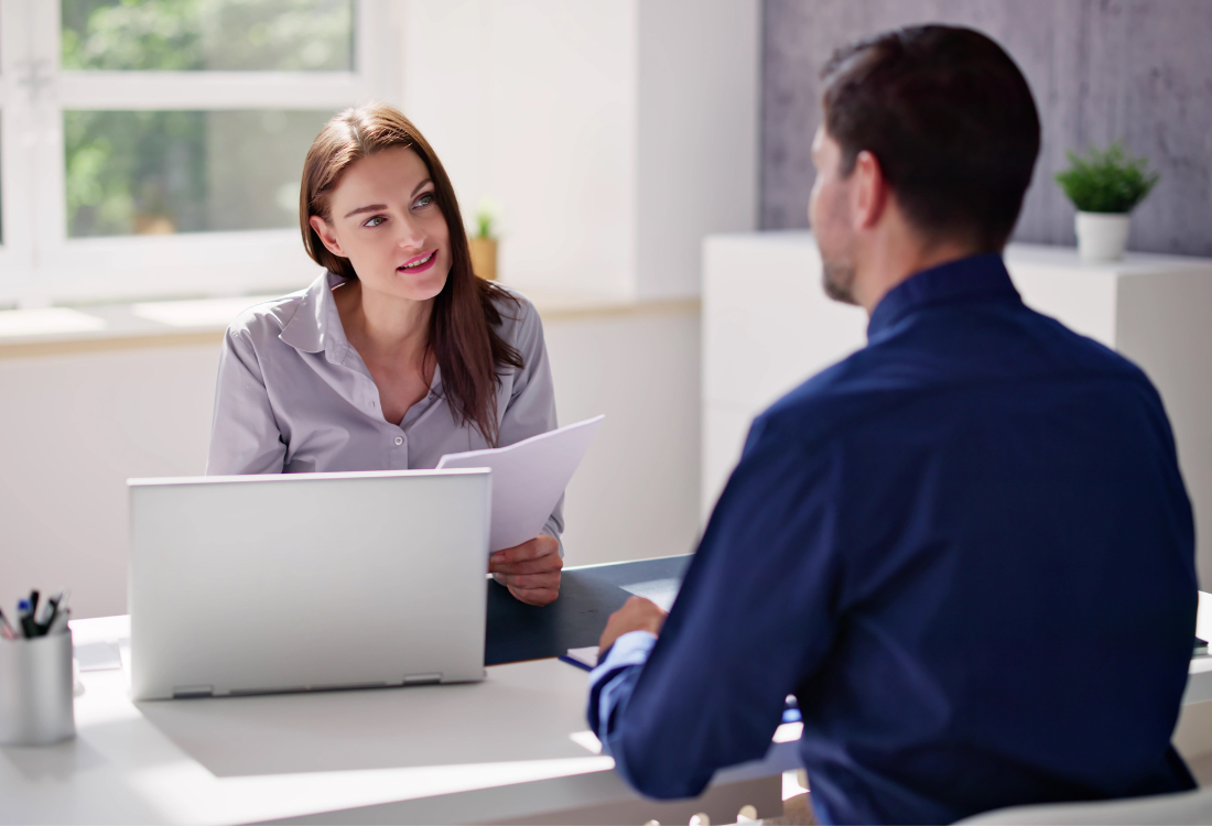 Sole trader meeting with an outsourced accountant to review documents and discuss Making Tax Digital requirements. 