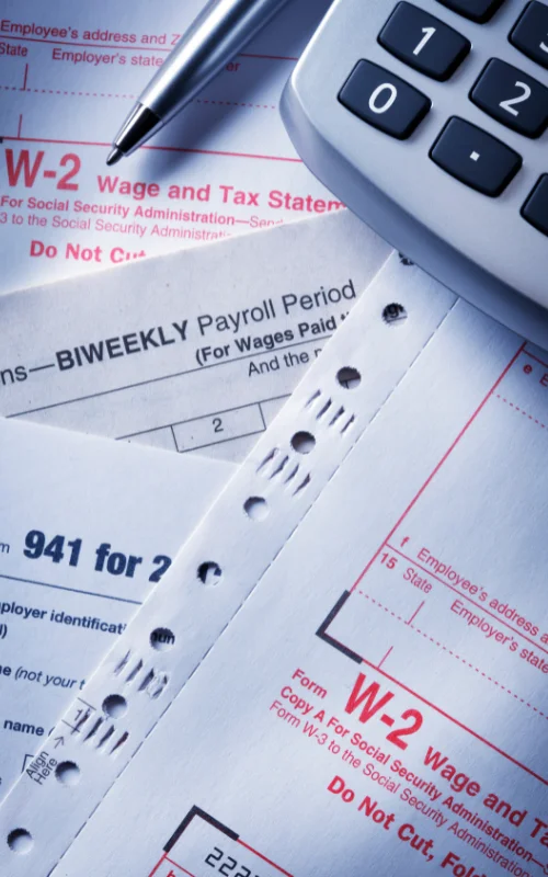 Calculators and paper being used to provide tailored tax advice