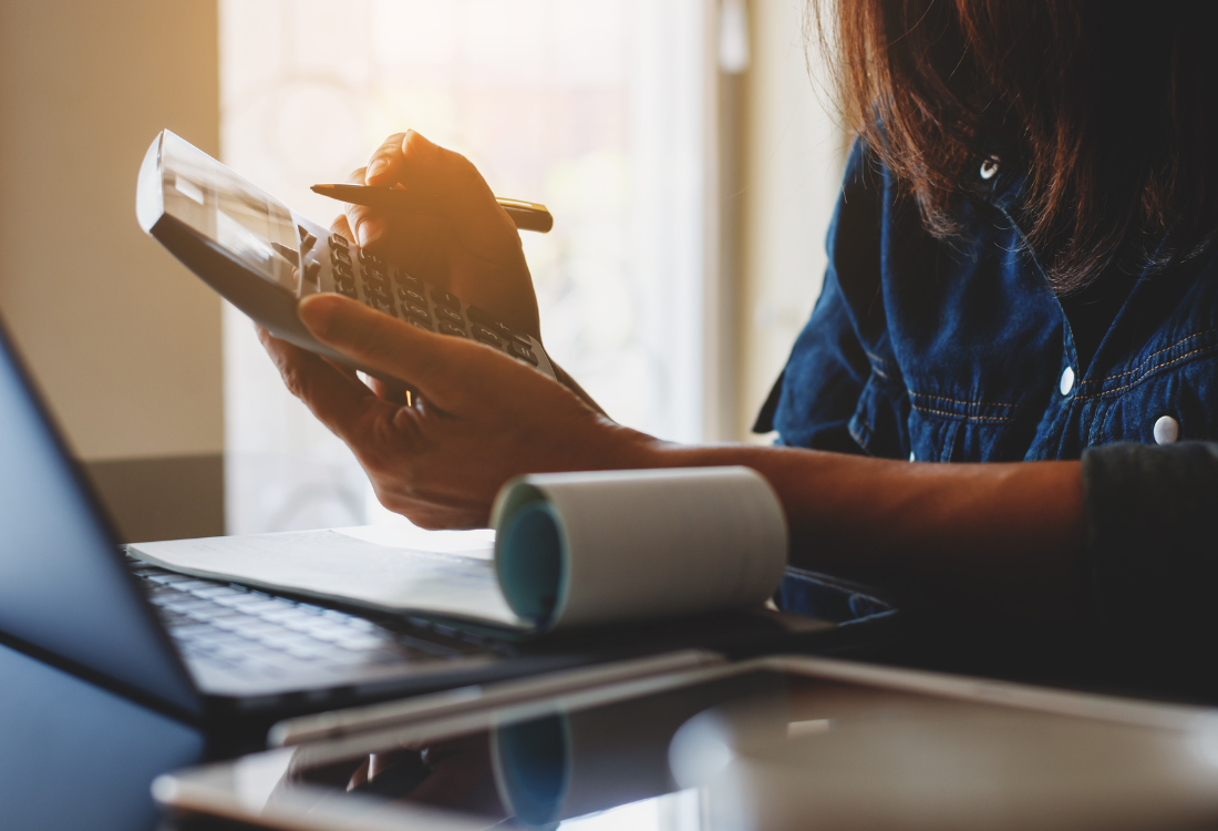 A female accountant providing an outsourced payroll service to save money for a business. 